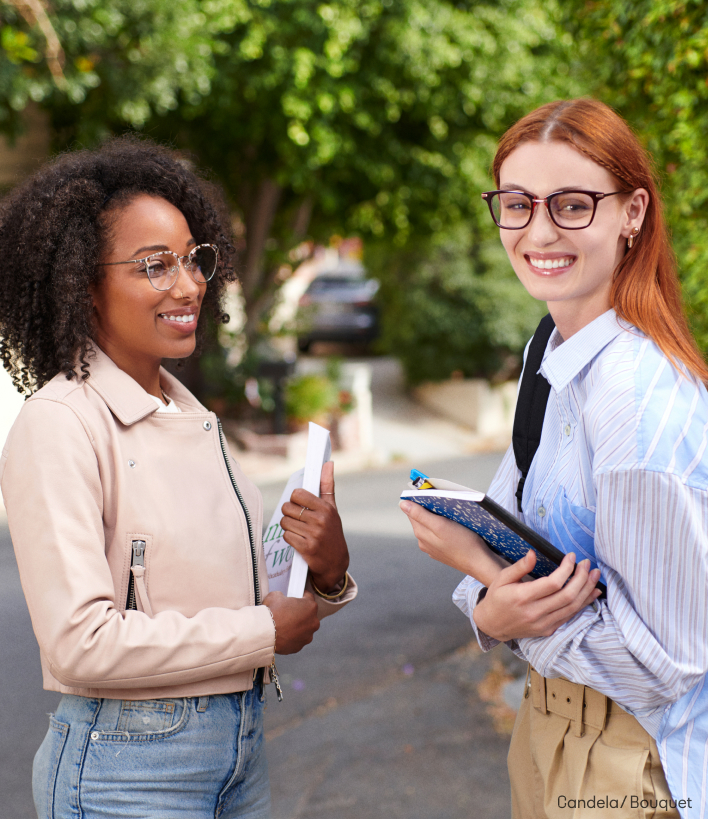 To woman standing outside wearing blue light glasses